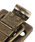 Close-up of Old School Metal Clasp Latch Set For Jewelry Boxes And Chests, showcasing vintage iron hardware design.
