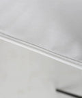 Close-up view of the clean white non woven fabric on the Rock Solid Six Shelf Hanging Closet Organizer with dividers.