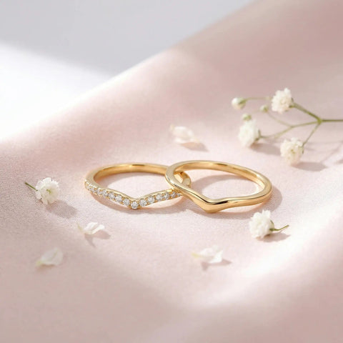 Stackable Pinky Ring For Women Stainless Steel Solitaire Band In Gold on pink background with flowers, non-tarnish, comfortable fit