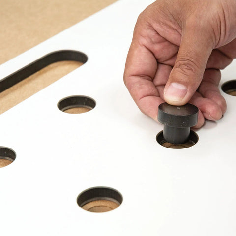 Heavy Duty Multi Functional Table Routing Jig Made For Mft Style Worktops And Plunge Router Setups display of index pin being inserted into jig.