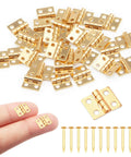 Gold Mini Dollhouse Hinges Kit With 30 Tiny Hinges And 120 Nails For 180 Degree Full Motion Copper Metal DIY Hardware For Miniature Furniture Jewelry Boxes And Cabinets 0.31 x 0.39 Inches Hobby Craft Essentials shown with hinged pieces on fingers and included nails displayed.