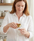 Woman holding Beekeeping Beehive Entrance Feeder Lids Replacement Metal Caps For Regular Mouth Mason Jars Anti Rust Syrup Dispenser.