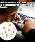 Watchmaker assembling timepiece with Brass Clock Hand Nut Kit With 12 Pieces In 5mm 6mm And 10mm OD Sizes Replacement Set visible