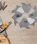Heavy Duty Carbide Biscuit Jointer Blade 100mm OD 22mm ID 3.92mm Thick on wooden surface with tools for cabinetry.