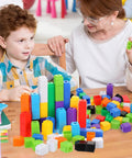 Child and adult using 300 Piece Colorful Counting Cubes Set for Math Manipulatives, Plastic Connecting Blocks in preschool learning.