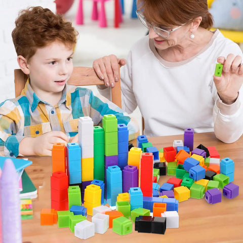 Child and adult using 300 Piece Colorful Counting Cubes Set for Math Manipulatives, Plastic Connecting Blocks in preschool learning.