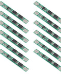 12 Pack 1S 3.7V 4A BMS Protection Board For 18650 Lithium Ion Cells laid out on a surface, showcasing circuit components and design.