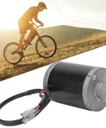 Beefy 24V 100W DC Brushed Motor With Carbon Brushes Aluminum Alloy Housing And Metal Belt Pulley For Electric Scooter And Bike displayed alongside cyclist