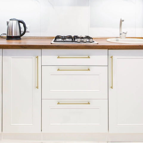 No Cap Required With These Brushed Gold Kitchen Cabinet Pulls Featuring 12 And 3/5 Inch Hole Centers Bang For Your Buck Zinc Alloy Drawer Handles For Total Space Glow Ups In A 5 Pack Bundle on white cabinets.
