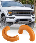 Tow Hook Cover Kit For Ford F150 And Bronco Models 2004-2026 With Tremor Orange Silicone Rubber Upgrade displayed in front of truck