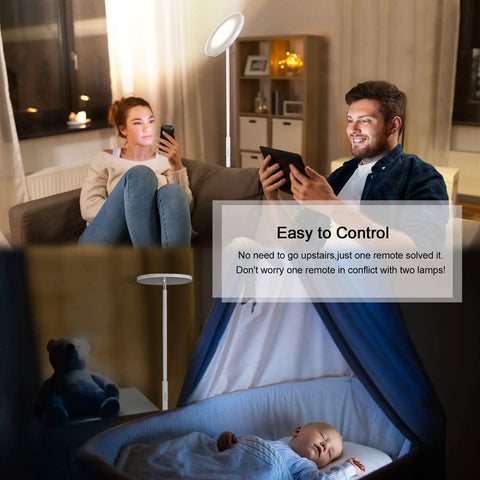 Couple relaxing with Super Bright Floor Lamp 30W 2400LM Sky LED Torchiere in living room, pearl white finish, baby sleeping nearby