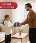 Man giving boy a wrapped gift in a living room, labeled 'Gift for Golf Lovers'