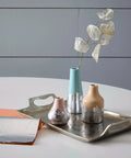 Speedball Mona Lisa water-based sealer 2 oz; still-life with metallic-leafed ceramic vases on a silver tray.