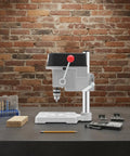 Sootvp 340W Mini Bench Drill Press With Adjustable Speed and Portable Table Design on a workbench with accessories.