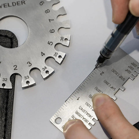 Person using Round Dual Sided Metal Sheet Gauge And Thickness Gauge 2 Pack Pro Grade Stainless Steel Welding Gauge for measurements