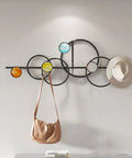 Heavy Duty Metal Wall Mount Coat Hooks For Entryway Living Room Bedroom Sturdy Rack with colorful circles holding a hat and bag.