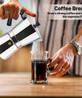 14 Cup Aluminum Moka Pot Stovetop Espresso Brewer 700ml 23oz Percolator Mocha Pot Greca Style For Italian And Cuban Cafe Silver Coffee Maker For Home Brew Enthusiasts pouring coffee into a glass mug on a kitchen table.