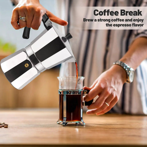 14 Cup Aluminum Moka Pot Stovetop Espresso Brewer 700ml 23oz Percolator Mocha Pot Greca Style For Italian And Cuban Cafe Silver Coffee Maker For Home Brew Enthusiasts pouring coffee into a glass mug on a kitchen table.