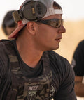 Man wearing Fugitive TAC Spartan Version 2.5 Photochromic Sunglasses For Men Built For Day And Night Use Tactical Eye Protection