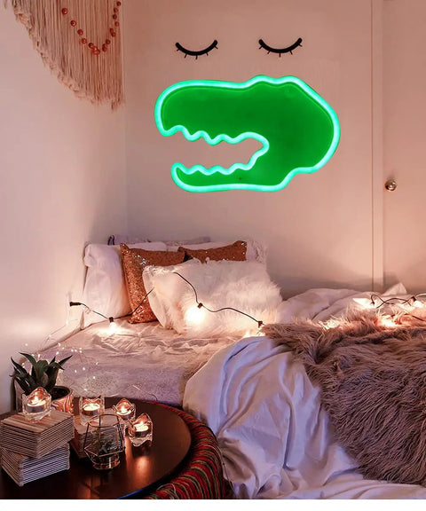 Totally Lit Dinosaur Head Neon Sign For Kids Bedroom Decor USB Or Battery Powered Neon Light Wall Art For Home Office Parties Halloween Valentines Day Wedding Gifts hanging above a cozy bed setup.