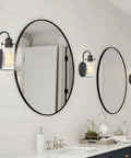Bathroom with Rayne 9.5 Inch Modern Farmhouse Wall Sconce Black Gooseneck Light With Tapered Seeded Glass Shade over vanity