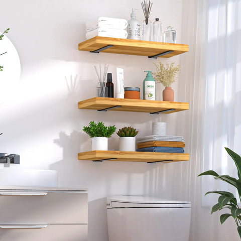 Heavy Duty 12 Pack Hidden L Shelf Brackets 12 Inch Matte Black Iron Floating Wall Mount Hardware For Rustic Industrial Shelving Built Different To Support 100 Lbs Per Pair, showcasing stylish wood shelves with plants and toiletries.
