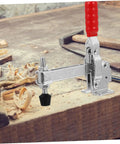 Two Piece Welding Fixed Toggle Clamps with Rubber Tips, Silver, on a woodworking bench in workshop