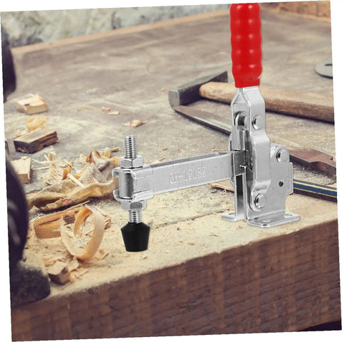 Two Piece Welding Fixed Toggle Clamps with Rubber Tips, Silver, on a woodworking bench in workshop