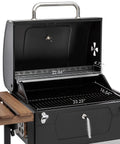 24 Inch Charcoal Grill With Folding Table And Handle Grilling Ready Backyard BBQ Smoker 490 Sq In Total Cooking Space Includes 384 Sq In Porcelain Enameled Grates And 106 Sq In Stainless Warming Rack Height Adjustable Charcoal Pan with open lid showing cooking grates