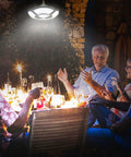 Group of people enjoying an evening under No-Brainer Solar Shed Light With Motion Sensor, 5 Modes, 180 LEDs, 360° Brightness