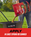 Person applying Lawn Bug Killer Granules For Large Yards Up To 10,000 Sq Ft Kills Ants Spiders Fleas And Ticks into a spreader.