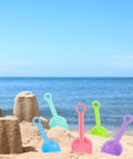 24 Pack Beach Shovels For Kids, 7 Point 7 Inch Plastic Sand Scoops In Bright 5 Colors, Bulk Beach Toys For Sand Play on sand