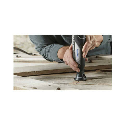 Close-up of Smooth Operator 12V Cordless Rotary Tool Bundle With 160 Piece Nifty Accessory Pack, cutting wood surface.