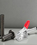 Push Pull Toggle Clamps Set Of 4 For Welding And Woodworking, Quick Release, Nonslip Clamps with red grip on a grey surface