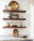 Wooden shelves supported by Hidden Floating Shelf Brackets 12 Pack 8 Inch Concealed Wood Shelf Support Invisible Coated Mounting Brackets For DIY Decor