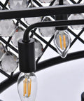 Close-up of Eight Light Crystal Pendant Lamp Mocha Bronze Polished Nickel Ceiling Fixture with clear glass orbs and iron grid.