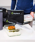 Glass Meal Prep Containers Set 5 Pack 30 Oz Each With Lids on kitchen counter with meal and prep bag