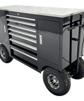 Badass Heavy Duty 500kg Rolling Toolbox With 7 Drawers Off Road Tires Racing Pit Wagon Cart with a steel cabinet and rubber wheels.