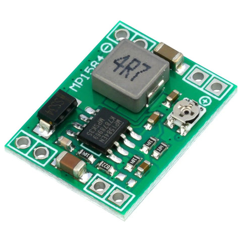 Close-up of Six Pack MP1584EN Buck Converter Module Kit for DIY Electronics showing detailed components and green circuit board.