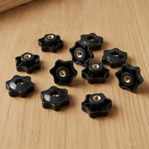 Top Shelf Set 20 Piece Slick Star Knob T Track Bolts With Quarter Inch Female Thread Hexagon Head For Woodworking Jigs Lawnmowers And Patio Umbrellas Easy Grip Solid Clamp Hardware In Matte Black, close-up view on wood.