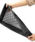 Hands holding 12 Pack Mesh Bottom Seed Starter Trays For Microgreens And Seedlings, 21 By 10.6 Inch Germination Trays, black plastic.