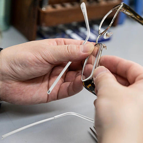 Hands installing Metal Eyeglass Arms Replacement Pair For Eyewear And Sunglasses With Slip Design For Quick Repairs And Extra Comfort
