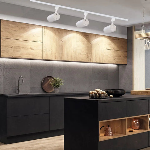 Modern kitchen with Three Color Temperature 20W LED Track Lighting Heads Dimmable Flicker Free 36 Degree Beam 2000 Lumen Per Head CRI90 Plus 3 Pack for Accent Kitchen Artwork and Retail Linear Track Lighting H Type installed on ceiling, illuminating wooden cabinets and black countertop.