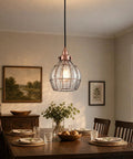 Red Antique Copper Glass Pendant Light With Cracked Glass Shade hanging over a dining table in a cozy room setting.