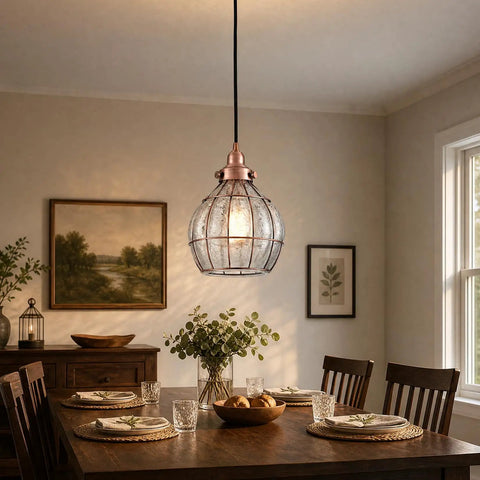 Red Antique Copper Glass Pendant Light With Cracked Glass Shade hanging over a dining table in a cozy room setting.
