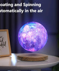 Floating Moon Lamp With 18 Colors, 5.9 Inch Magnetic Levitation Night Light That Spins In Air on wooden base