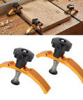 4 Piece Heavy Duty Aluminum T Slot Hold Down Clamps For Woodworking CNC Router And Milling Machine with rubber coated ends on a wooden surface.