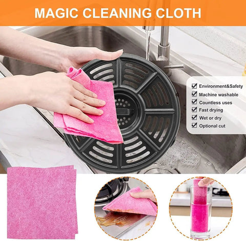 Magic Cleaning Cloth being used to wipe a black crisper tray in a sink, highlighting the durable material and easy cleaning.