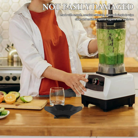 Person using a blender in a kitchen with a Juicer Spout Splash Guard Replacement Part For FS301 And FS300 Vertical Juicers Black