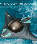 Top view of a Waterproof Camera RC Boat With App Control For Adults, featuring 6 channels, floating on water.